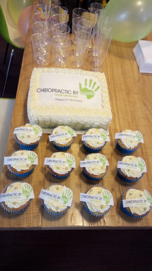 Anniversary cake and drinks at Chiropractic by Hand in Balham
