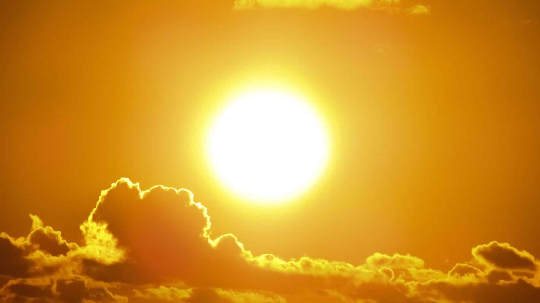 sun rising above the clouds