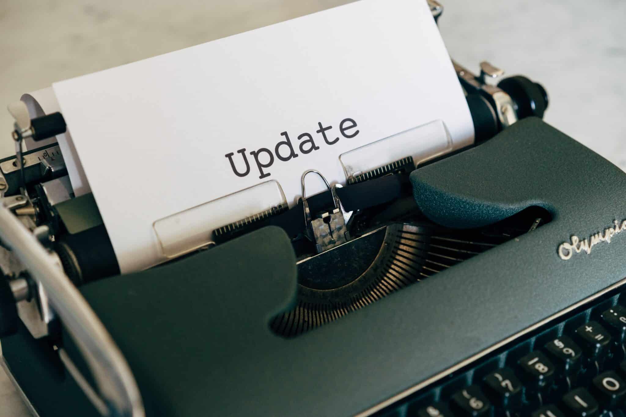 typewrite with paper saying update on it